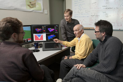 Researchers and computer screen
